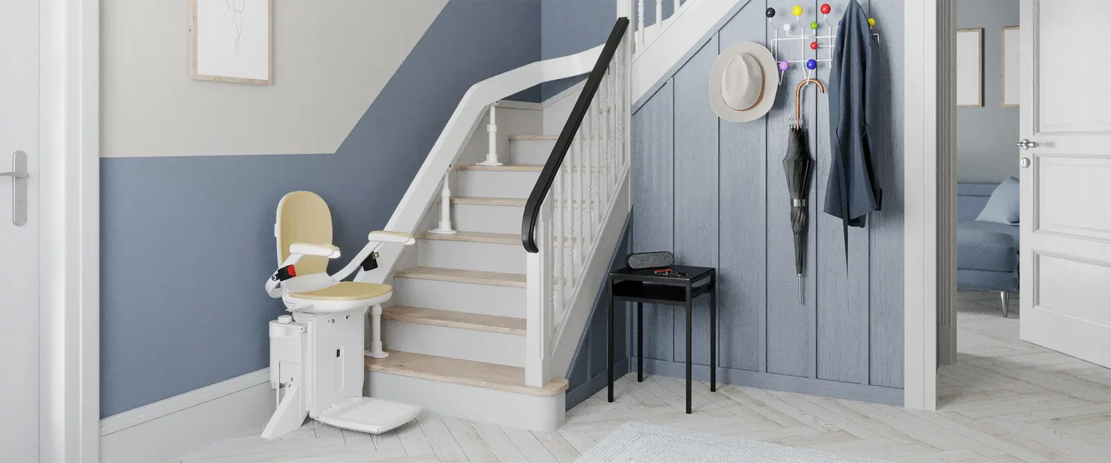 Cream stairlift on a straight indoor staircase, wide view